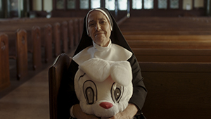 Still for God, Golf, and Glory - nun with a rabbit costume head