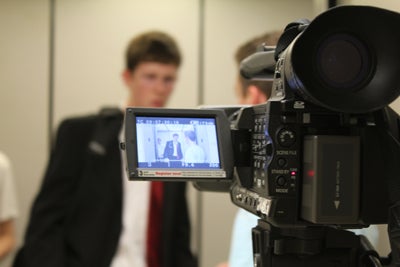 photo of a video camera shooting a scene.