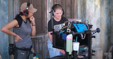 Two students working on a film set