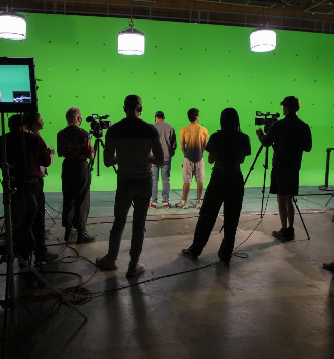 Group of students with green screen