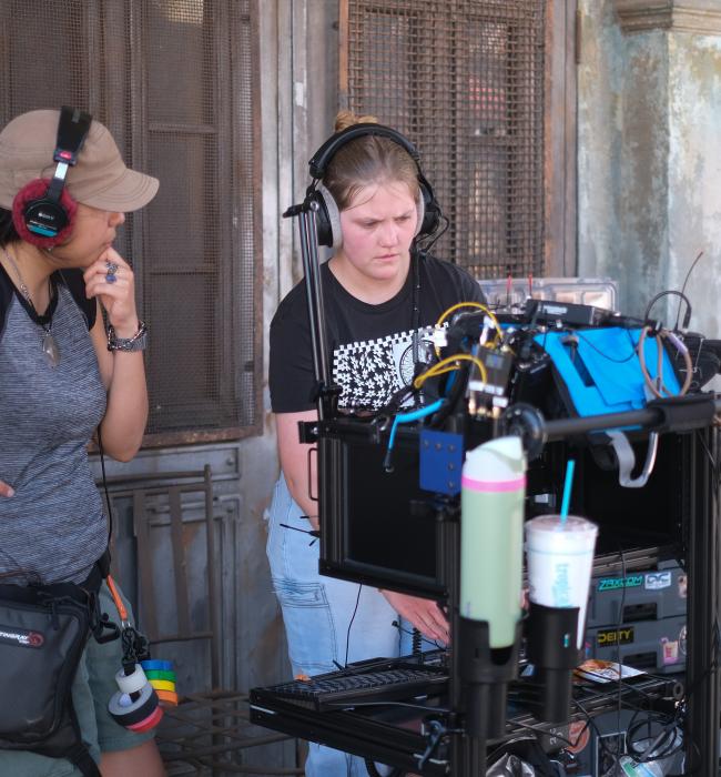 Two students working on a film set