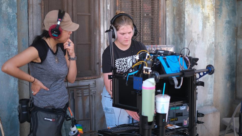 Two students working on a film set