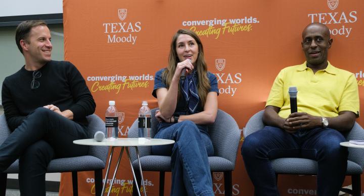 group of professionals speaking on panel