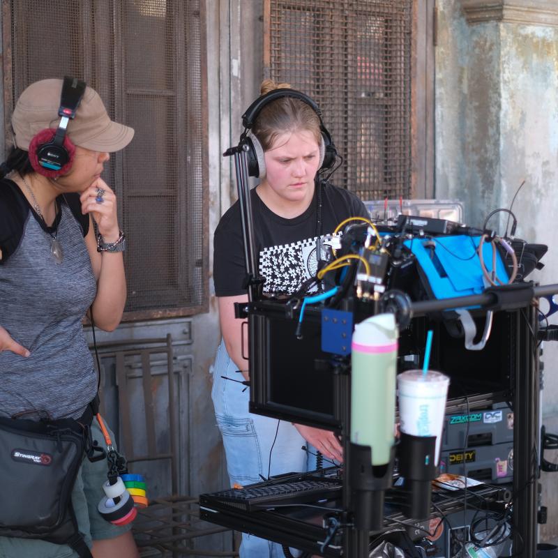 Two students working on a film set