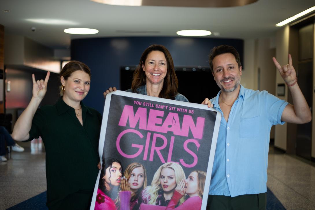 people holding movie poster